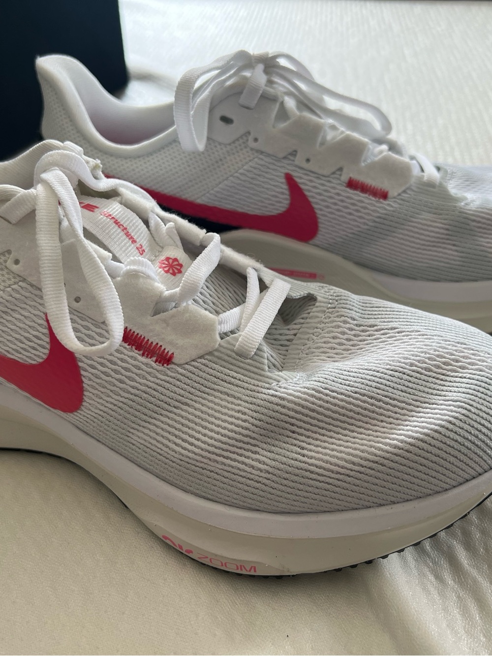 Nike Women’s White Running Sneakers with Pink Swoosh Accent